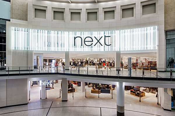 Shop front of a Next store at the Arndale Centre, Manchester