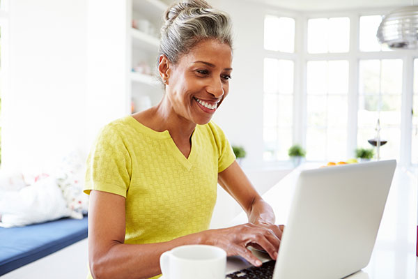 A female investor studying Model Portfolio figures on a laptop