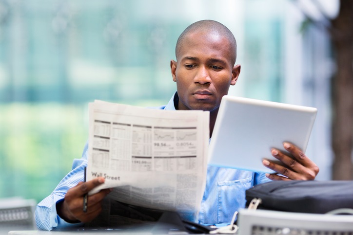 trader with paper and tablet