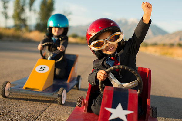 Two boys in a go-cart race