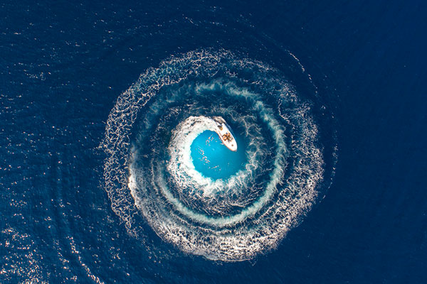 A boat circling in the sea
