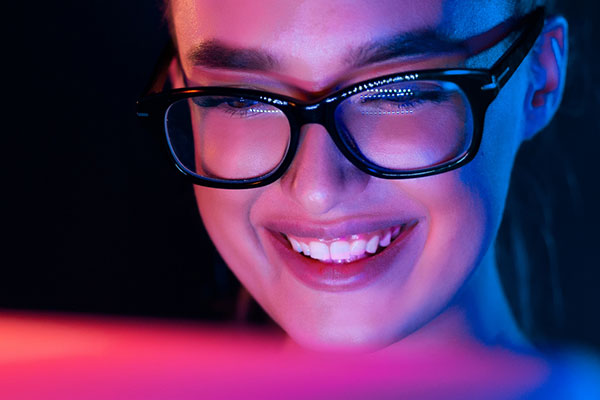 Smiling woman at laptop