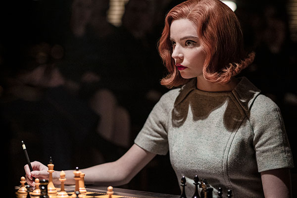 A still of the main character playing chess from Netflix show The Queen's Gambit
