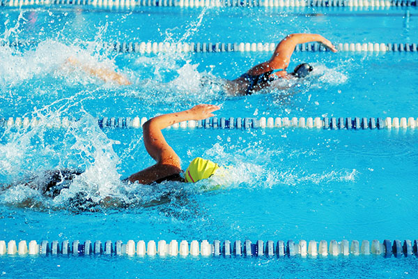 Swimmer pulling ahead in a race
