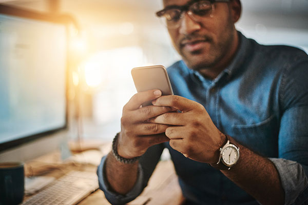 An investor trading on a smartphone