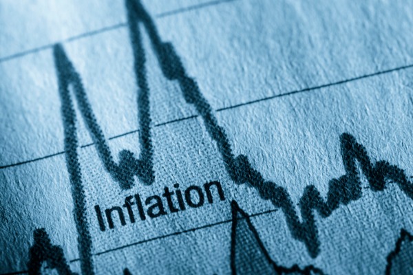 The word inflation accompanied by a chart that shows how inflation rates change over time.  