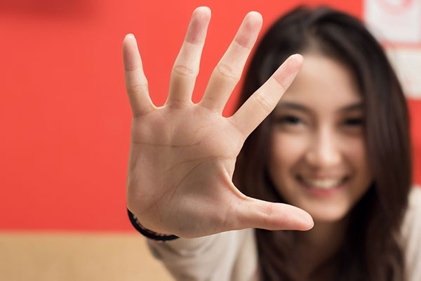 Investor holding up her hand