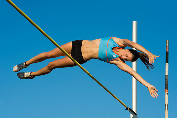Athlete clearing high beam