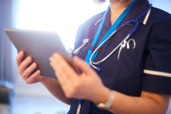 doctor-or-surgeon-checking-patients-records