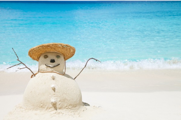 snowman-made-of-sand-in-straw-hat-at-the-beach- winter