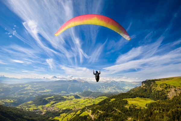 high flyer paraglider-flying-over-mountains
