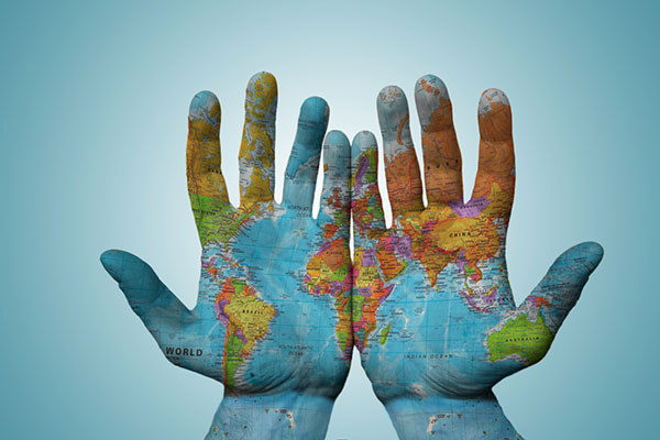 Hands with world map 600 x 400