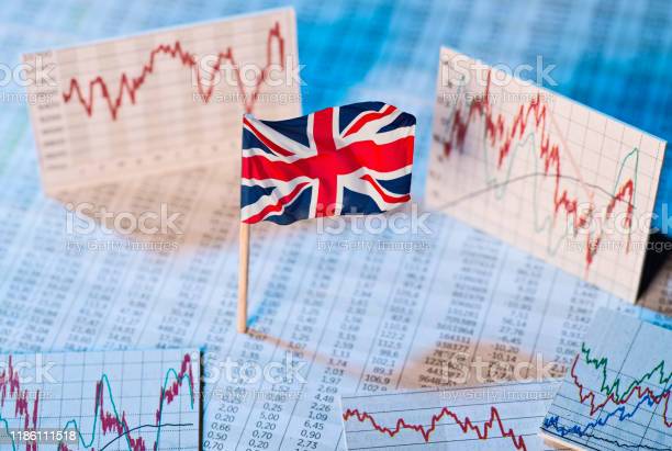 Image of UK flag with stock market charts.