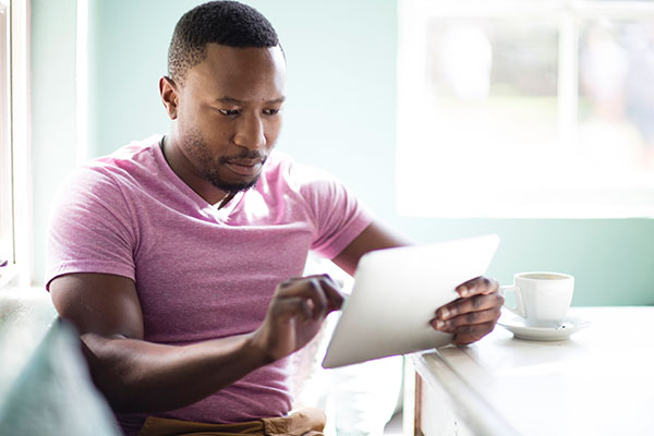 Investor reading on his tablet 600