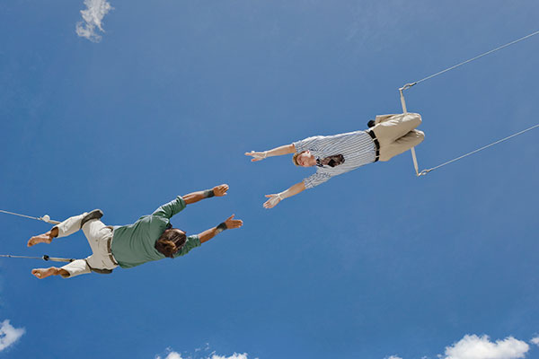 Trapeze artists midair 600