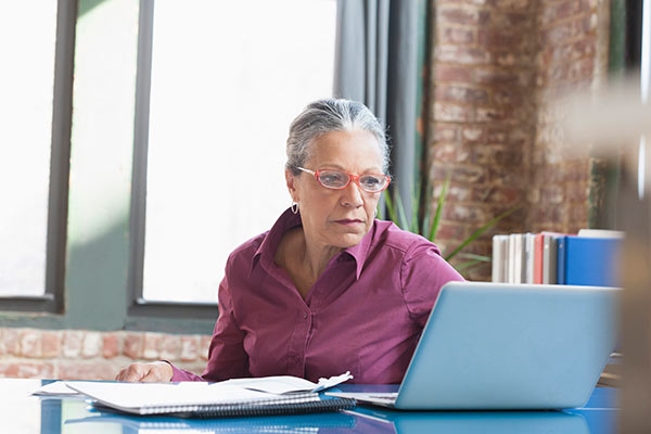 Pensioner reading about Budget changes 600