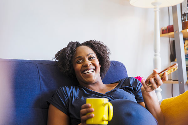 Pregnant woman thinking about maternity pay and pensions 600