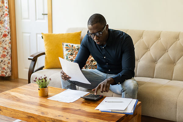 Man contemplating mortgage finance 600