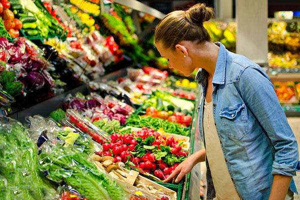 Shopper looking at prices during high inflation 600