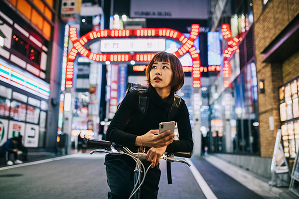 Woman on a bike in Japan 600