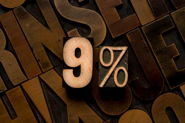 9% sign in wooden letters