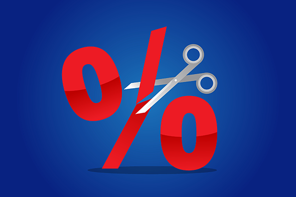 Scissors cutting through a red percentage sign Getty