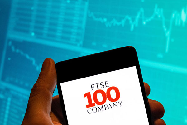 FTSE 100 firm logo on a smartphone