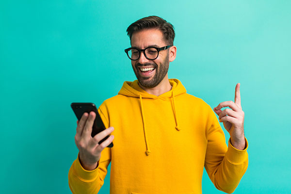 An investor looking at his smartphone