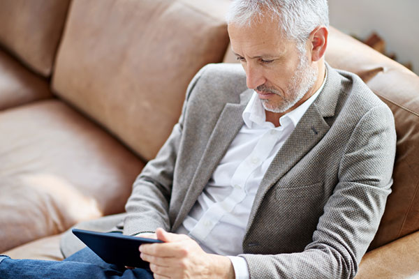 Investor reading on a tablet