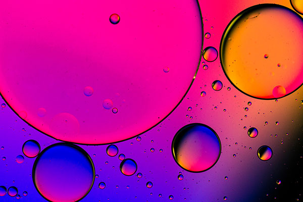 Bubbles against a colourful pink and lilac background