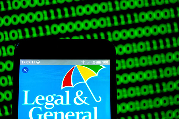 Legal & General logo on a smartphone with numbers in the background Getty