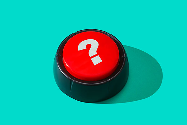 Red push button with a question point Getty