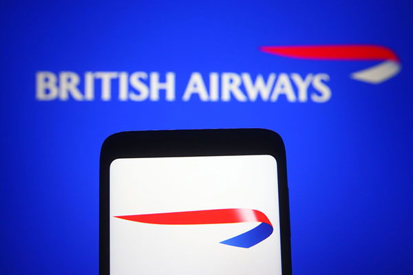 British Airways logo on blue background and smartphone Getty