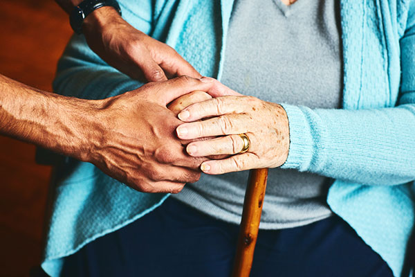 Elderly woman with a stick