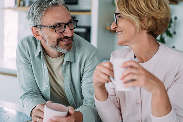 Midlife couple discussing what to do with their windfall 