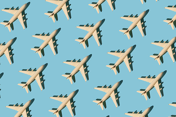 Airplanes against a blue background Getty