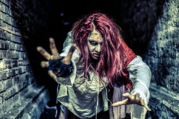 Female zombie in a tunnel