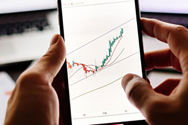 abrdn image of investor looking at chart on smartphone