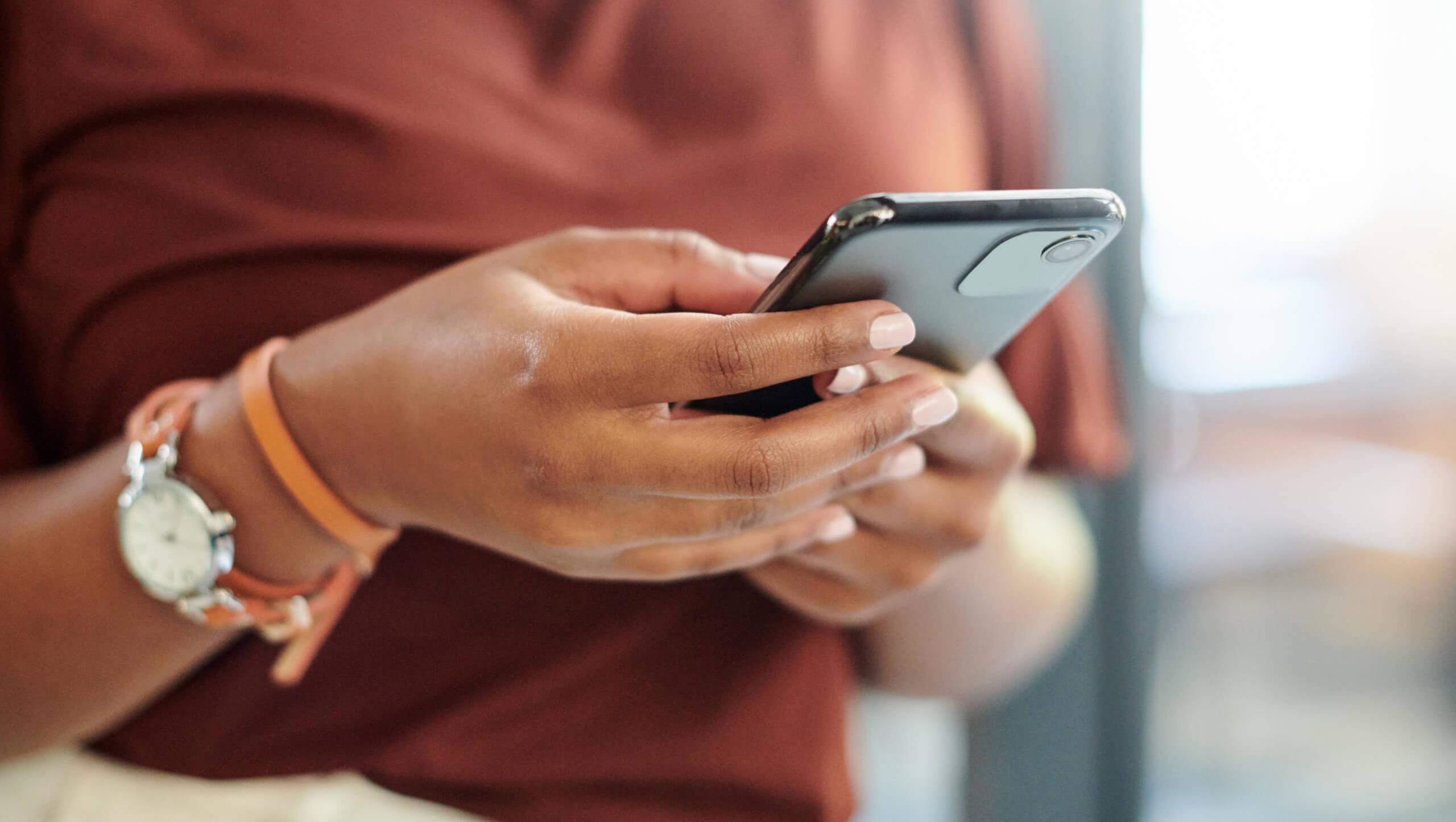 female hands holding mobile device