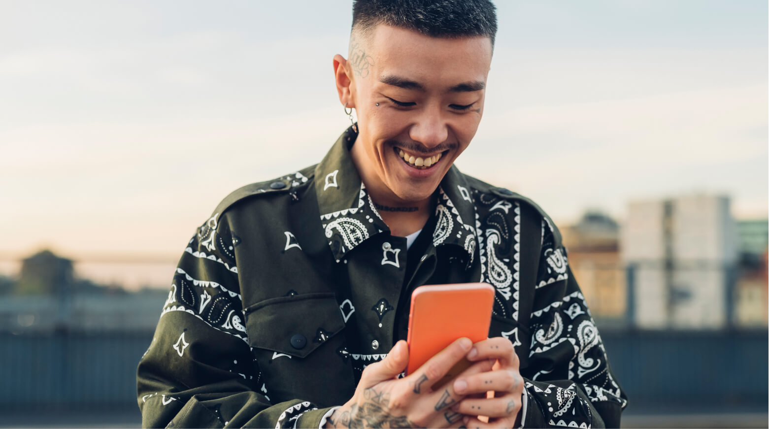 man looking at orange phone quick start funds