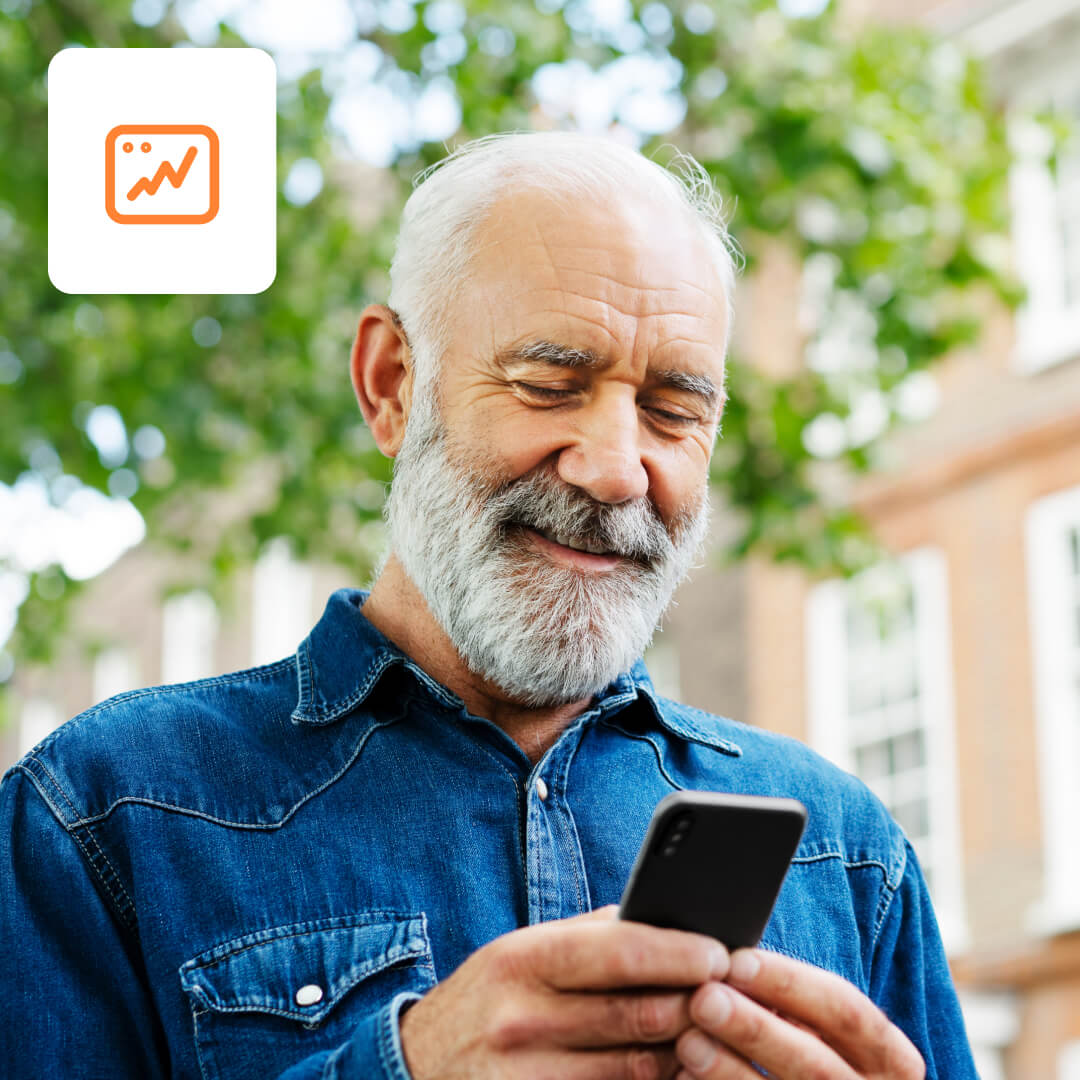 Older man looking at mobile device efts icon