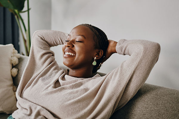 A woman relaxing on a sofa