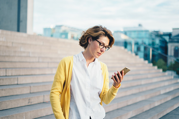 Investor looking at her phone