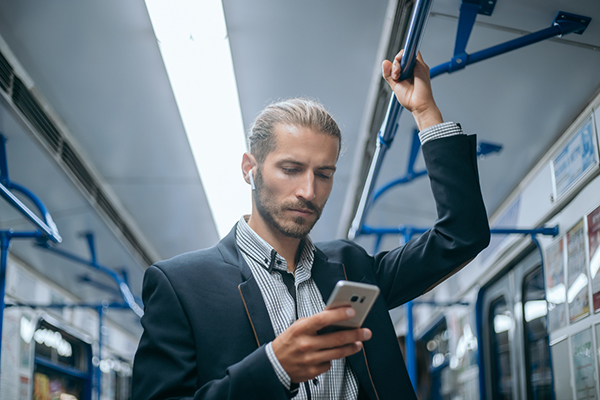 Man reading the news on his smartphone