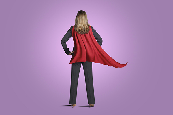 Dividend hero represented by woman wearing super-hero cape