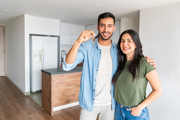 Couple holding the keys to their new home