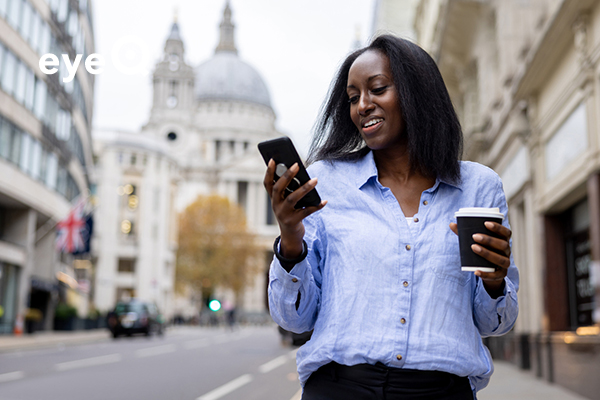 eyeQ Woman considering smartphone