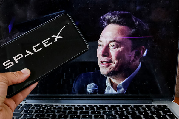 Space X logo and Elon Musk, Getty