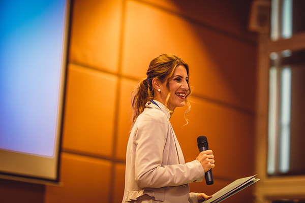 Woman with a microphone at an AGM