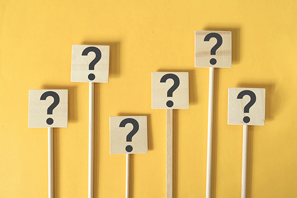 A host of question marks on a yellow background, Getty